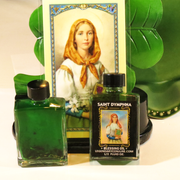 Blessing oil with Saint Dymphna image and green leaf background