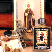 Bottle of St. Martin Porres conjure oil with a cross and religious image in the background